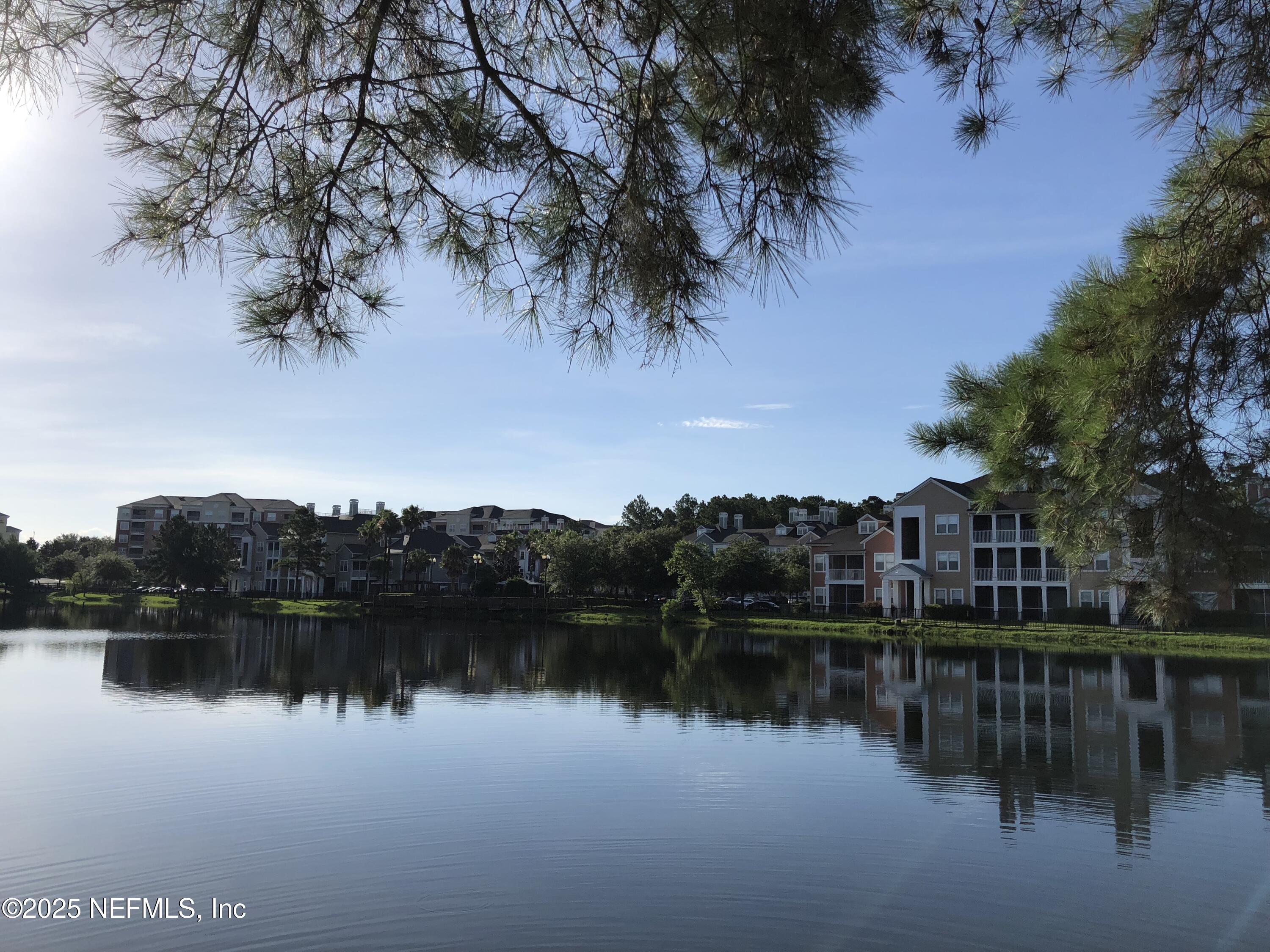 8550 Touchton Road, Unit 2133 Jacksonville, FL 32216 - Photo 23 of 41 a view of a lake with houses in the back