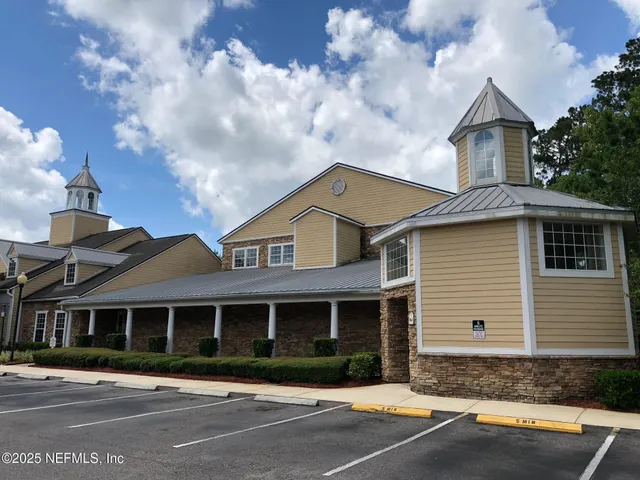 a view of sign board with a lake