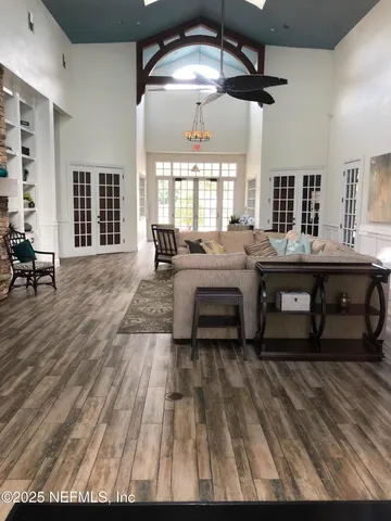 a swimming pool with outdoor seating and yard