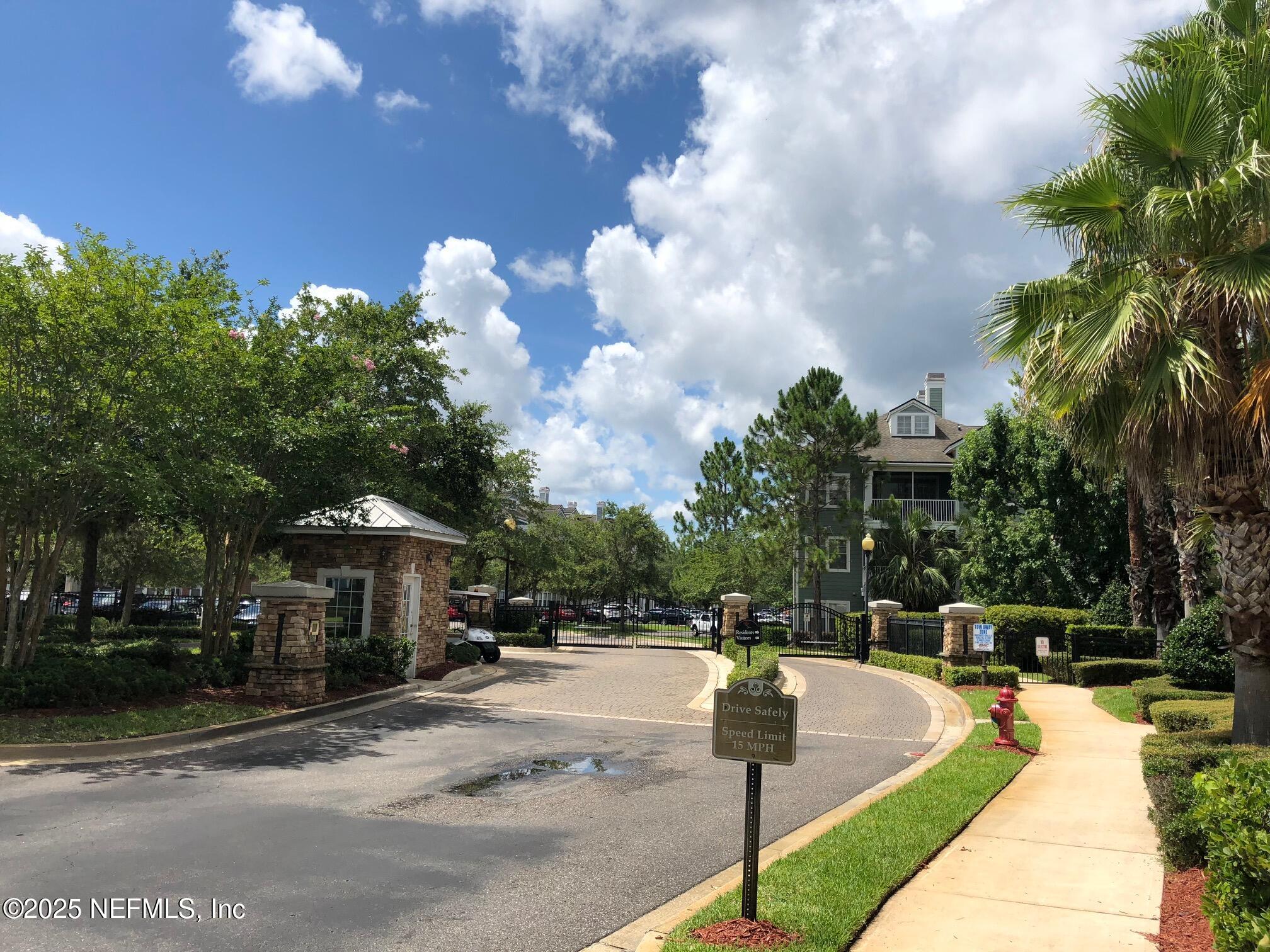 8550 Touchton Road, Unit 2133 Jacksonville, FL 32216 - Photo 33 of 41 a swimming pool with outdoor seating and yard