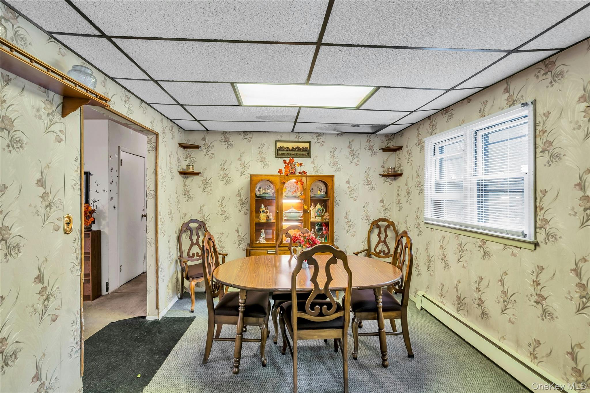 769 Meadow Road Smithtown, NY 11787 - Photo 12 of 27 a dining room with furniture and window