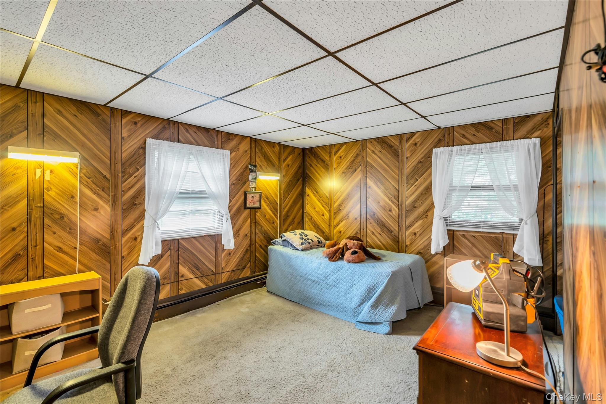 769 Meadow Road Smithtown, NY 11787 - Photo 13 of 27 a bedroom with furniture and a window