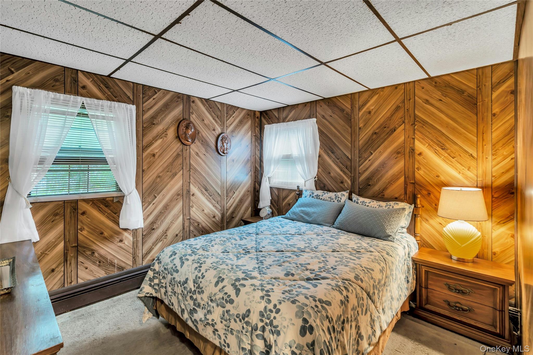 769 Meadow Road Smithtown, NY 11787 - Photo 15 of 27 a bedroom with a bed and a window