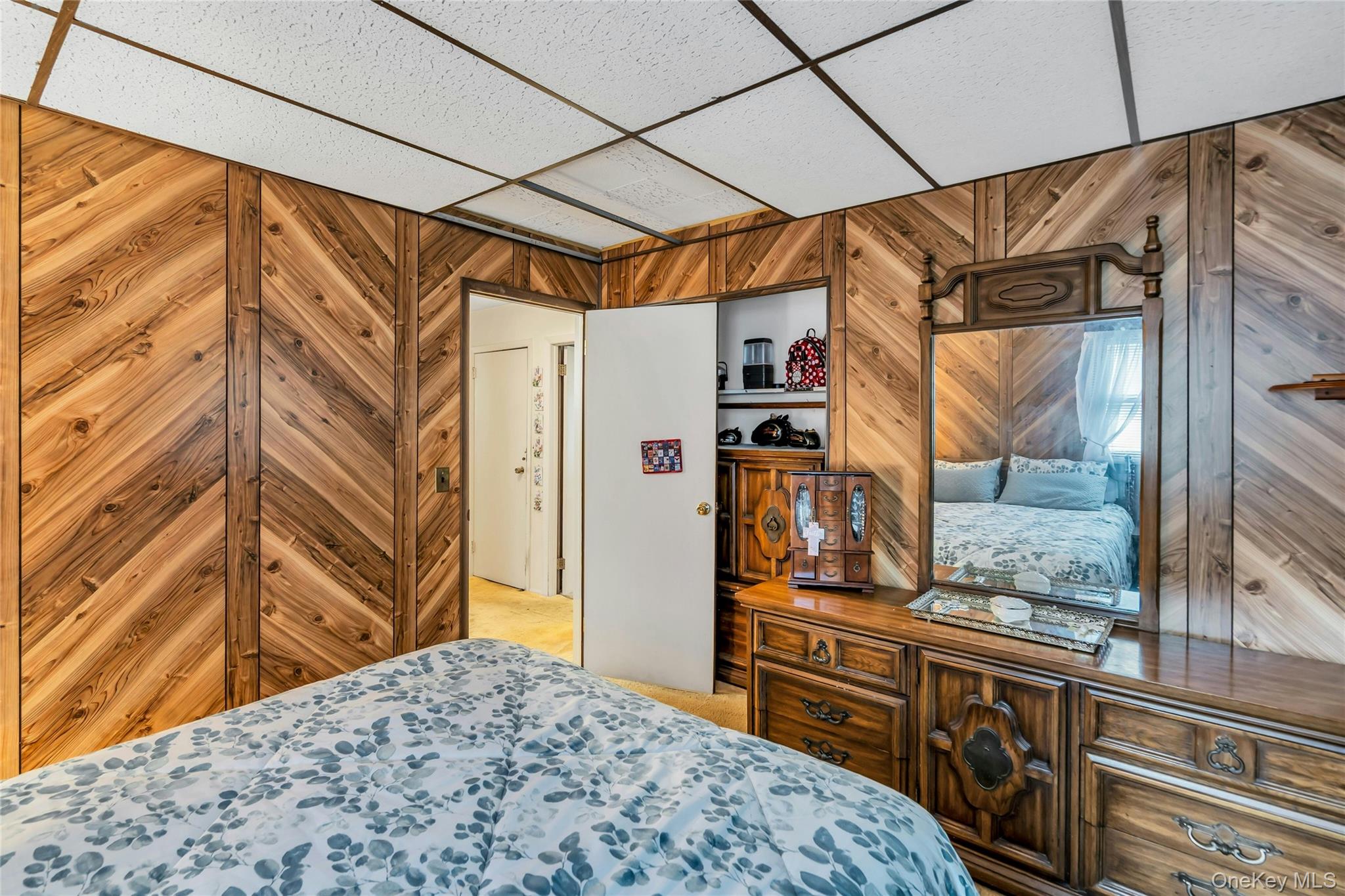 769 Meadow Road Smithtown, NY 11787 - Photo 16 of 27 a view of walk in closet with wooden floor
