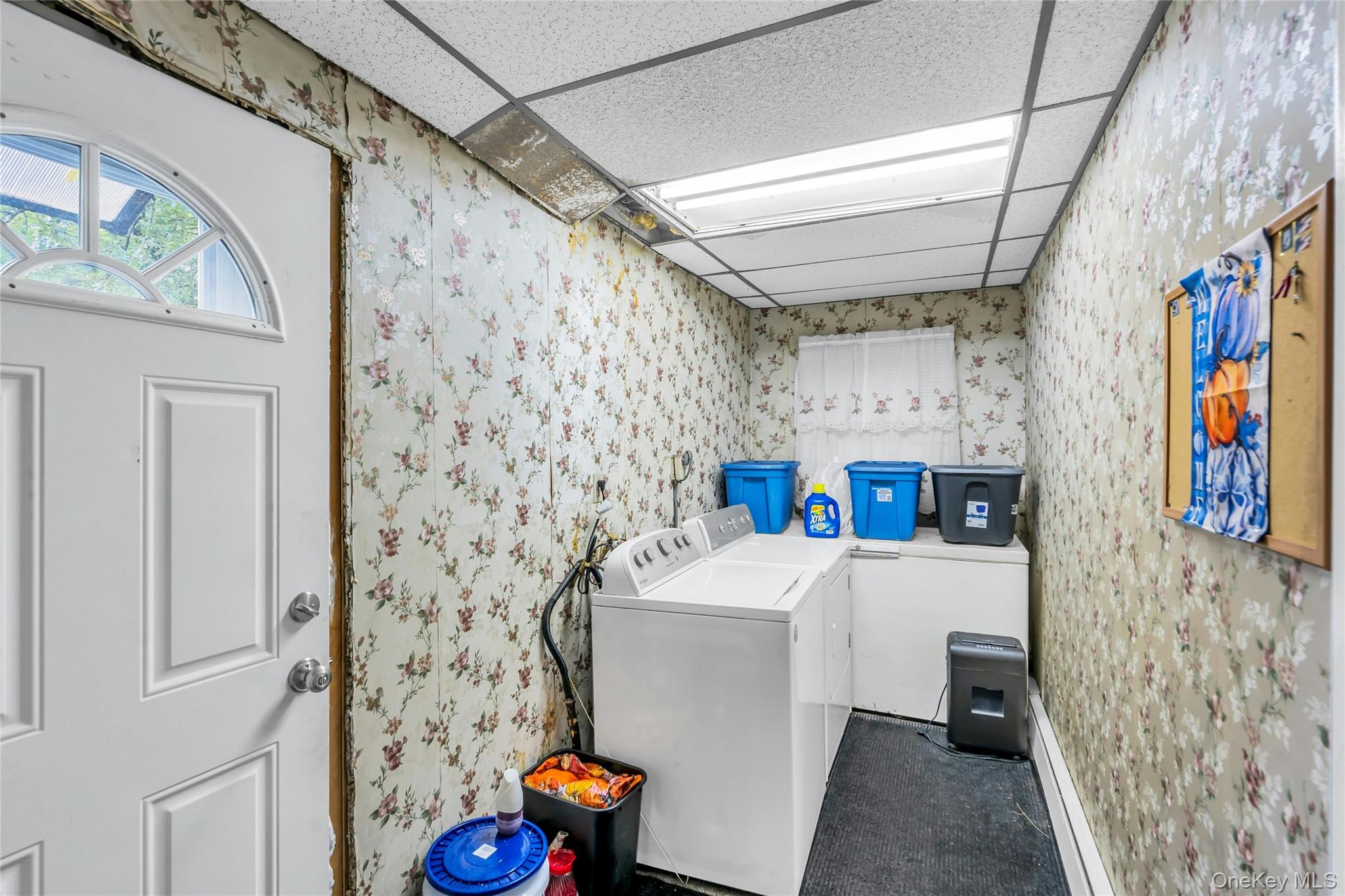 769 Meadow Road Smithtown, NY 11787 - Photo 18 of 27 a bathroom with a sink a toilet and shower curtain