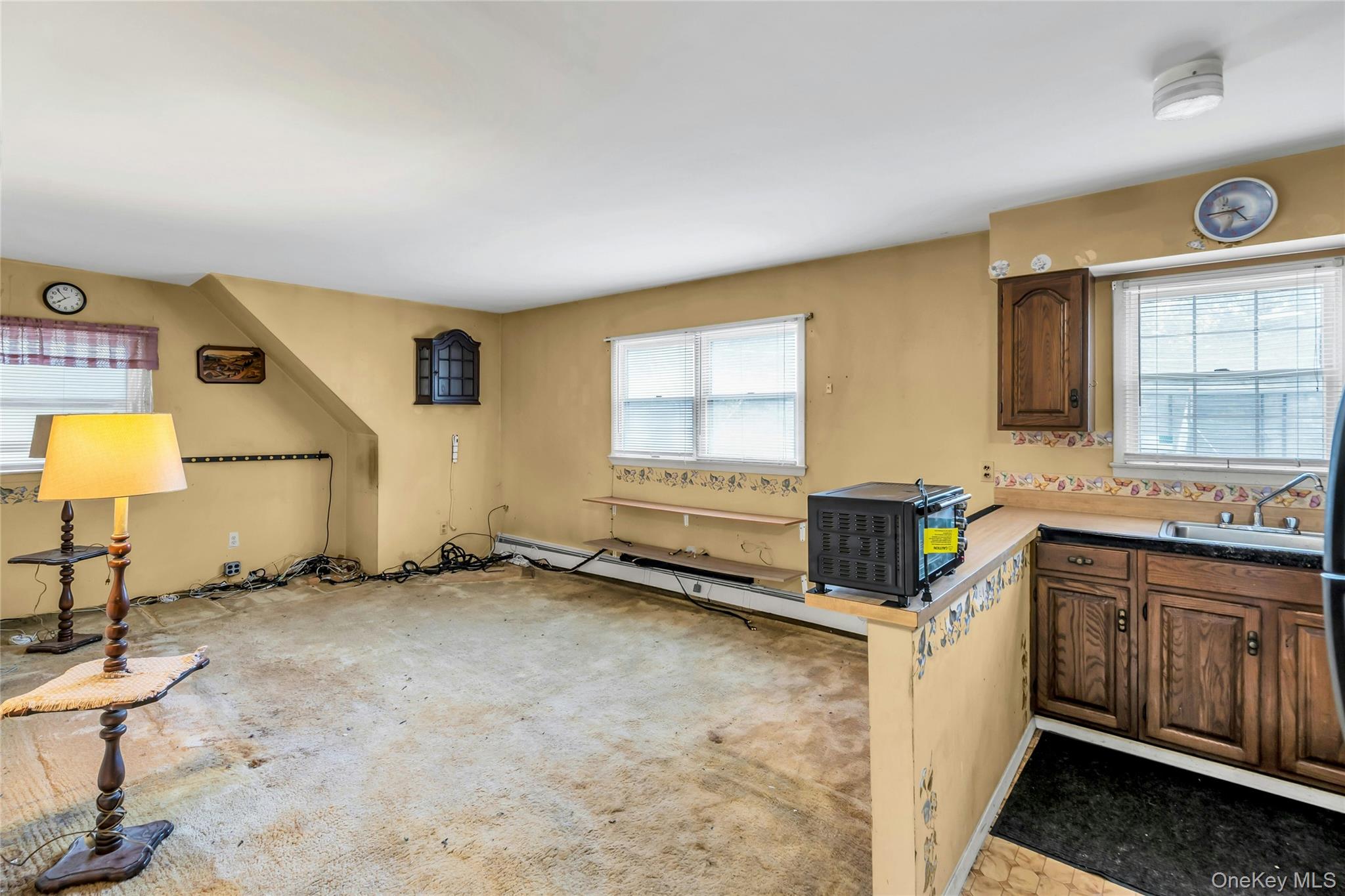 769 Meadow Road Smithtown, NY 11787 - Photo 19 of 27 a kitchen with sink cabinets and window