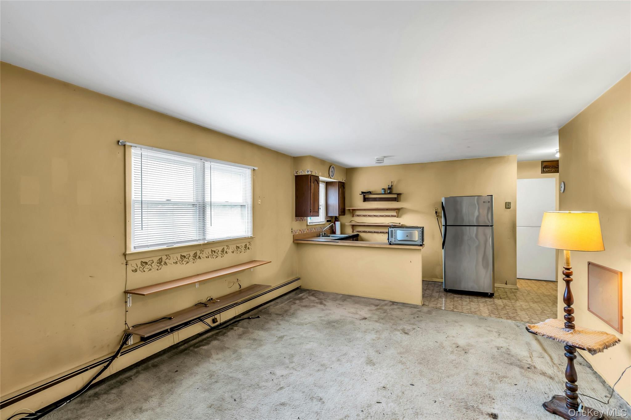 769 Meadow Road Smithtown, NY 11787 - Photo 20 of 27 a view of kitchen with furniture and refrigerator