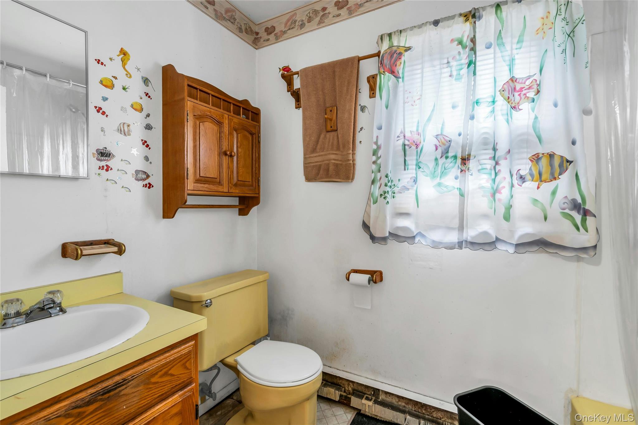 769 Meadow Road Smithtown, NY 11787 - Photo 25 of 27 a bathroom with a granite countertop sink mirror vanity and toilet