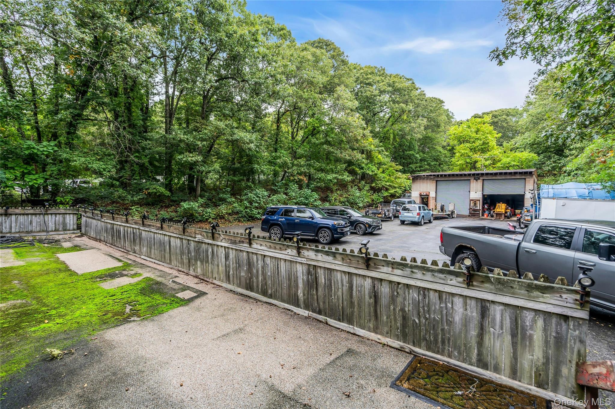769 Meadow Road Smithtown, NY 11787 - Photo 27 of 27 a view of a house with swimming pool and sitting area