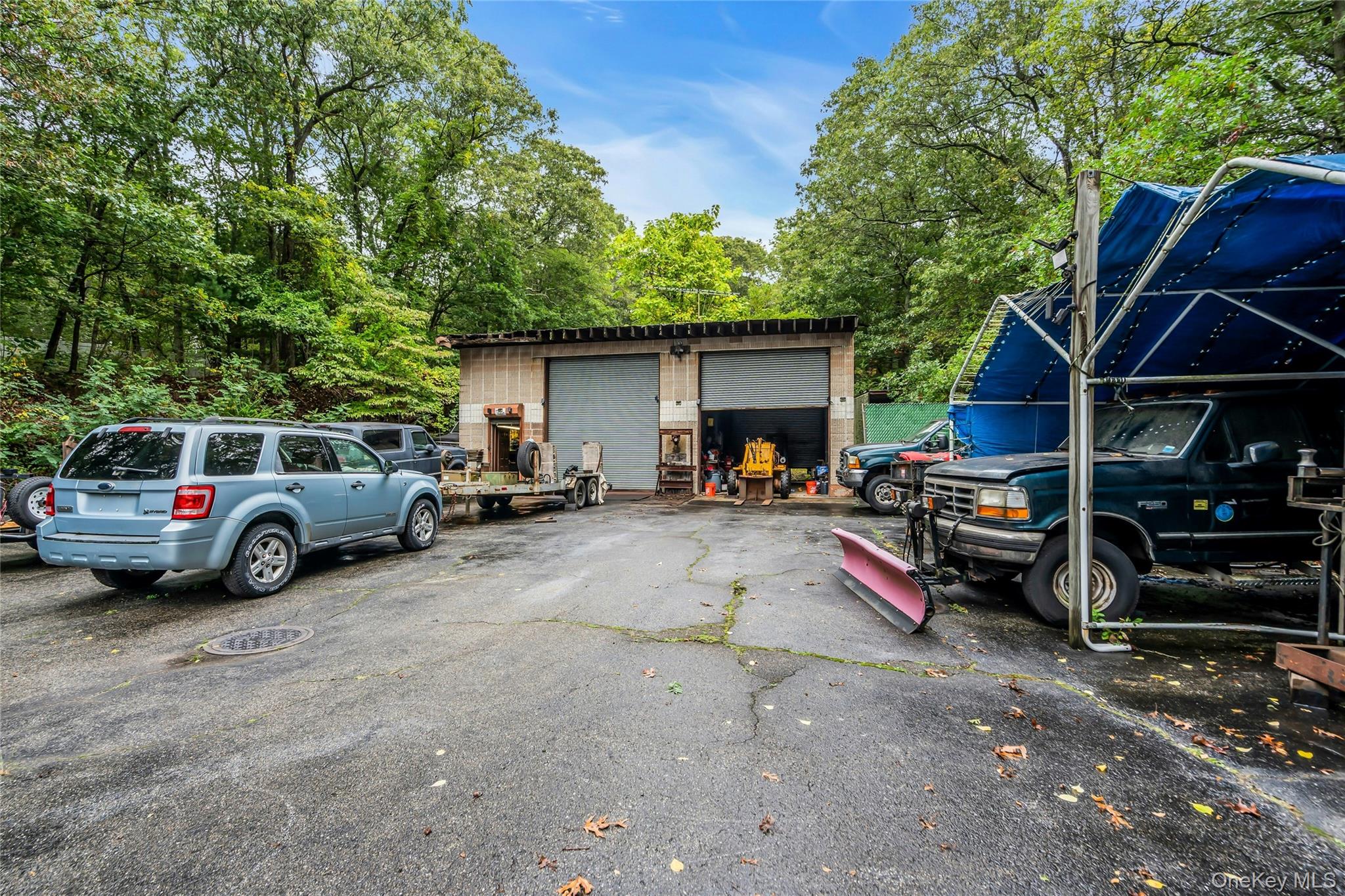 769 Meadow Road Smithtown, NY 11787 - Photo 6 of 27 a view of a cars park in front of house