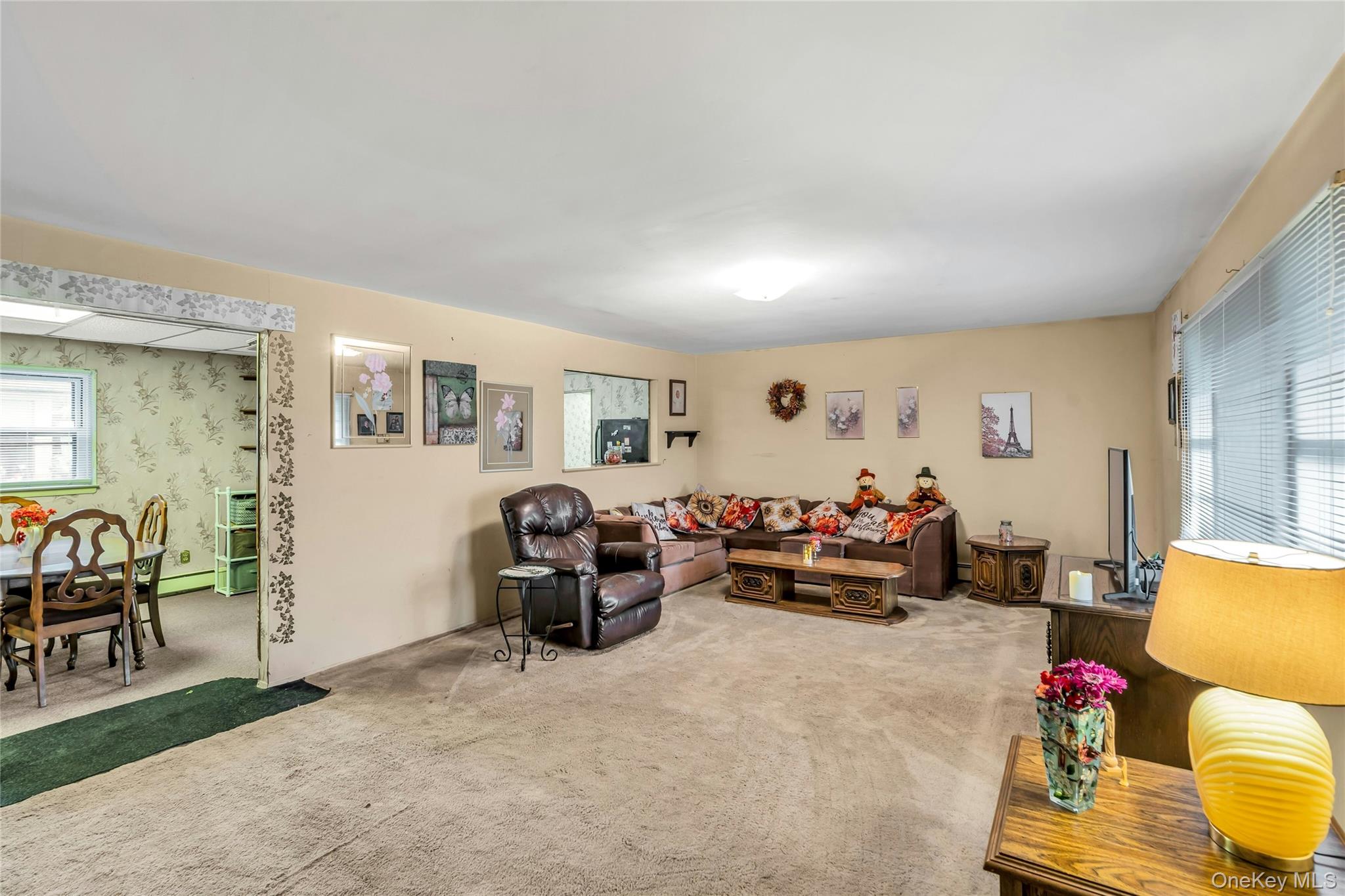 769 Meadow Road Smithtown, NY 11787 - Photo 7 of 27 a living room with furniture and a wooden floor