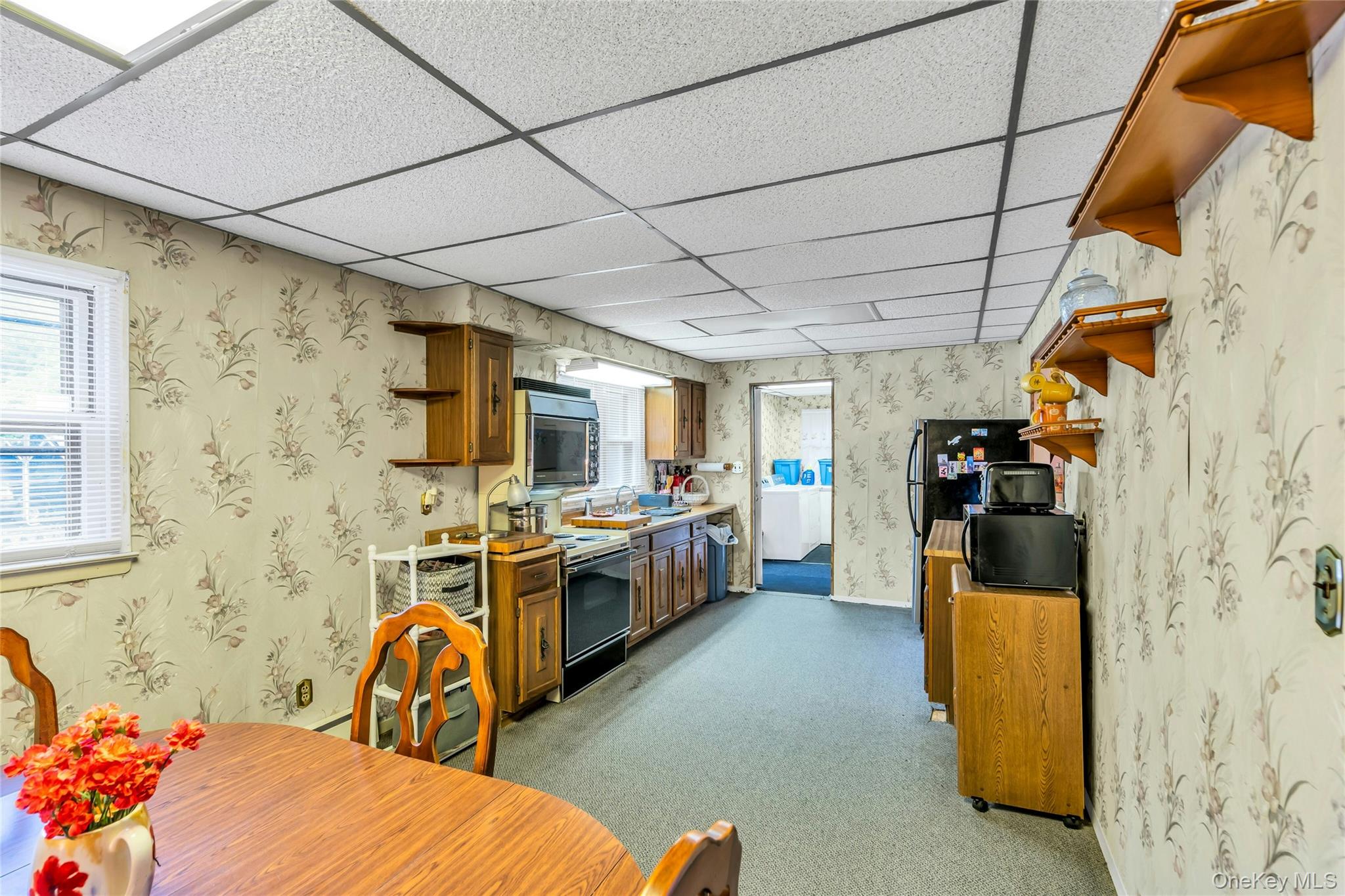 769 Meadow Road Smithtown, NY 11787 - Photo 9 of 27 a bed room with a bed and a couch