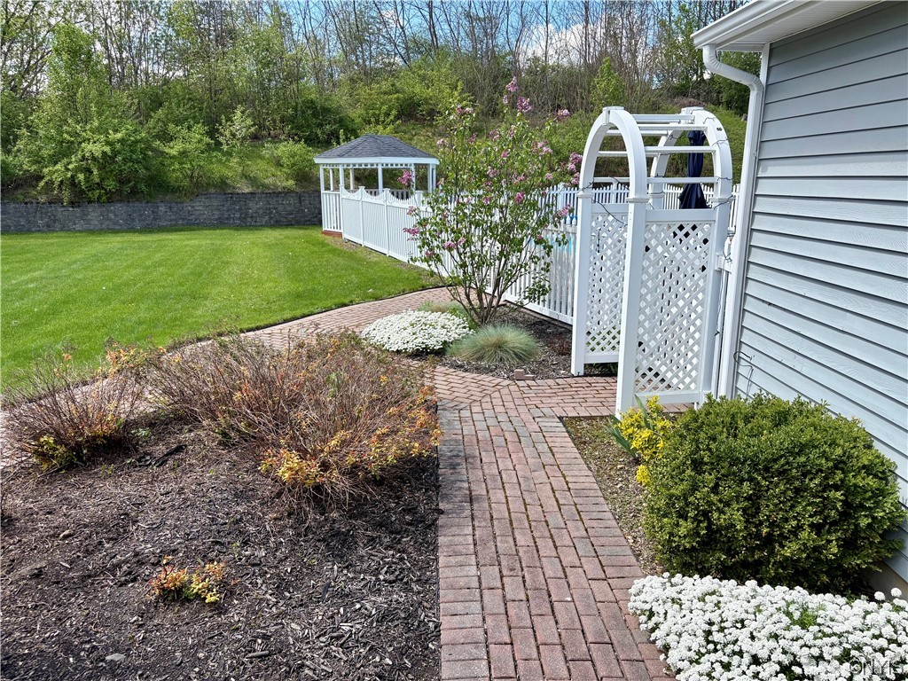 7892 East Ridge Pointe Drive Manlius, NY 13066 - Photo 5 of 46 Path to the pool from the laundry room.