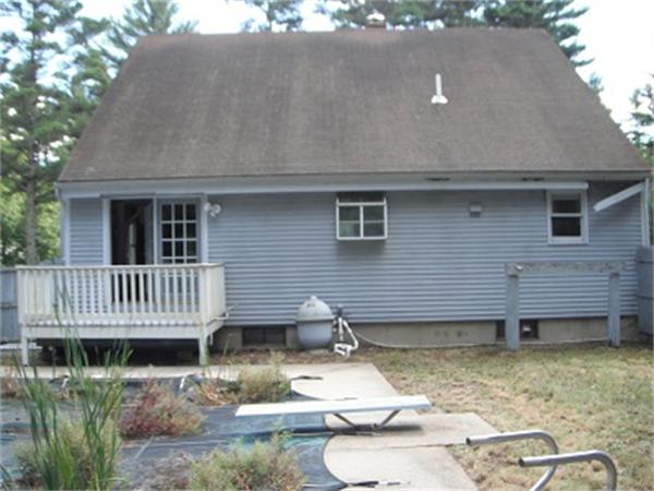 15 Porter Road Rochester, MA 02770 - Photo 5 of 12 a view of a house with backyard and deck