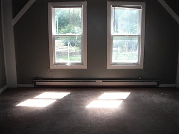 15 Porter Road Rochester, MA 02770 - Photo 9 of 12 a view of a room with gym equipment and windows