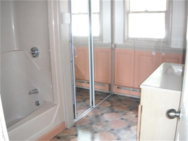 15 Porter Road Rochester, MA 02770 - Photo 10 of 12 a bathroom with a tub and a shower