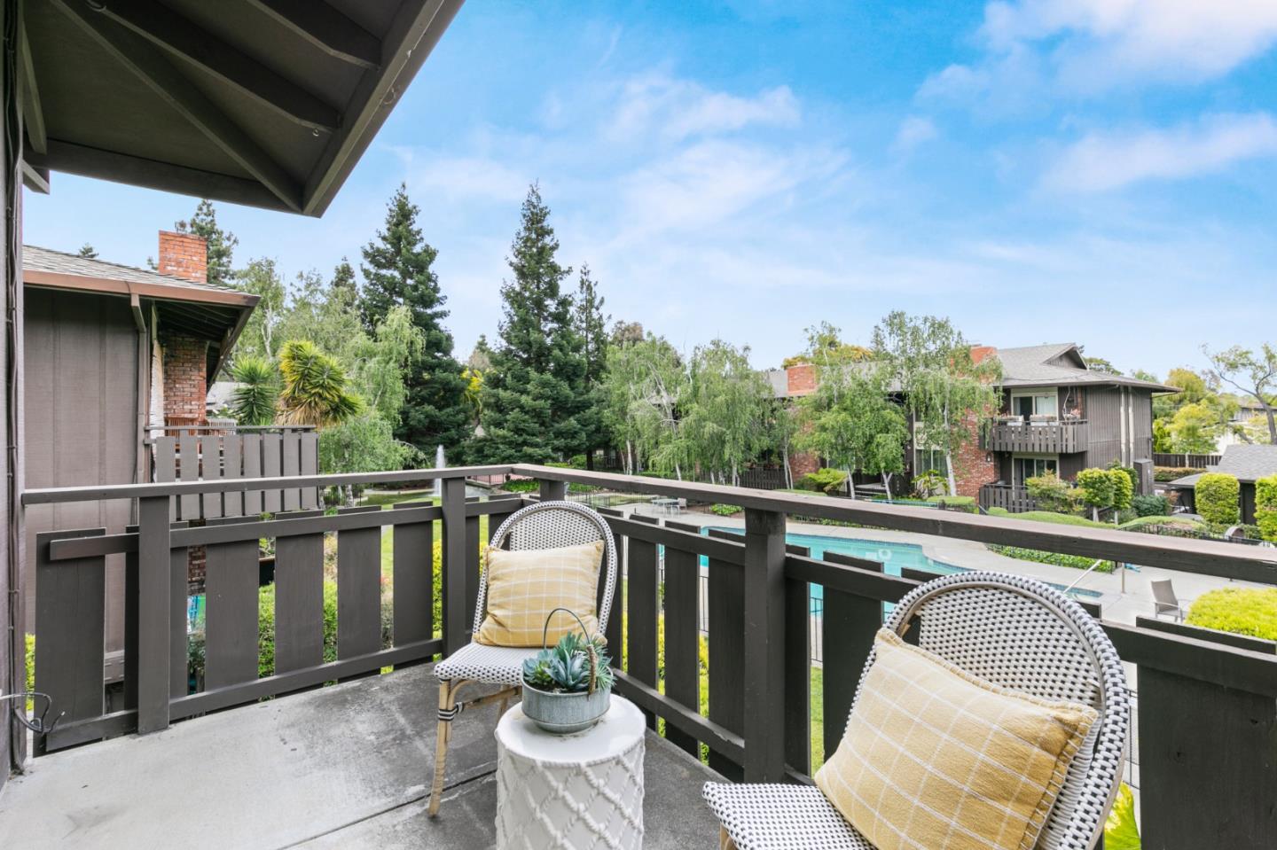 100 East Middlefield Road, Unit 2F Mountain View, CA 94043 - Photo 8 of 29 a balcony with furniture and a potted plant