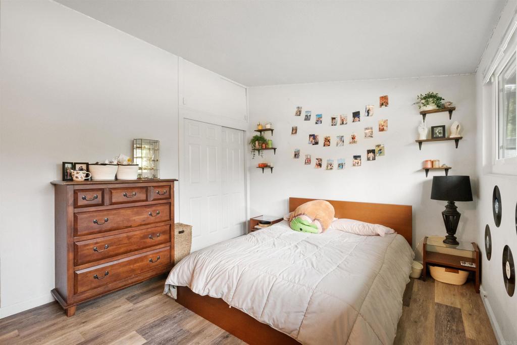 14102 Tobiasson Road Poway, CA 92064 - Photo 11 of 23 a bedroom with a bed and wooden floor