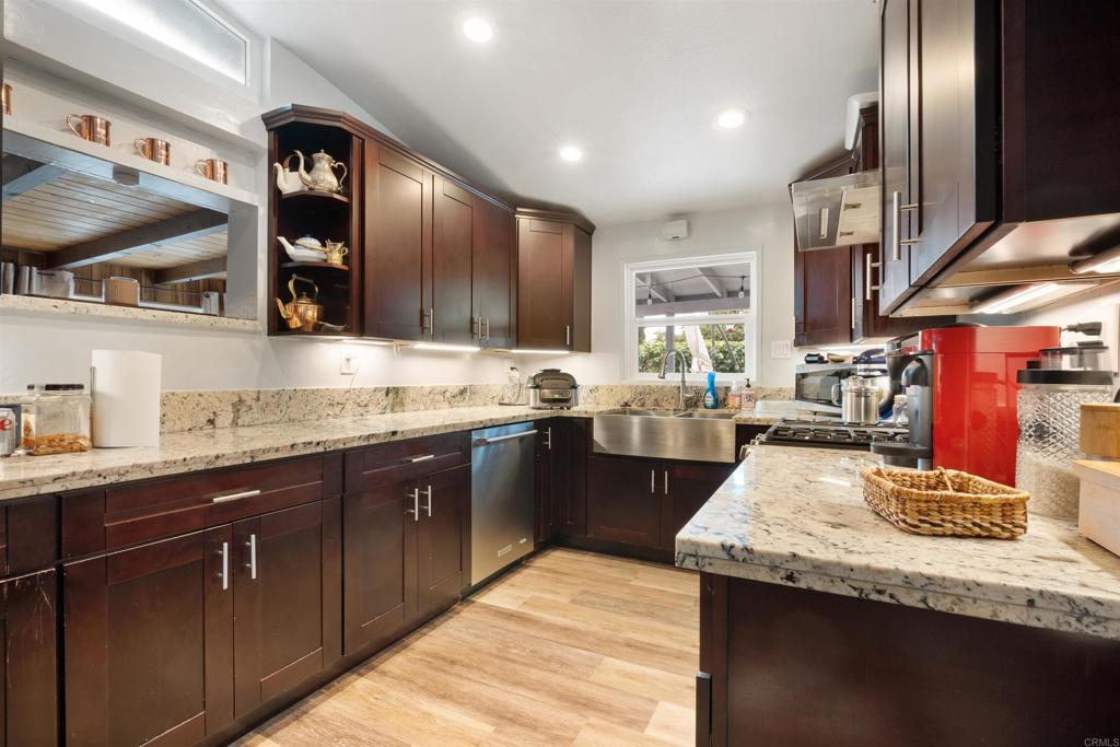 14102 Tobiasson Road Poway, CA 92064 - Photo 12 of 23 a kitchen with granite countertop lots of counter top space