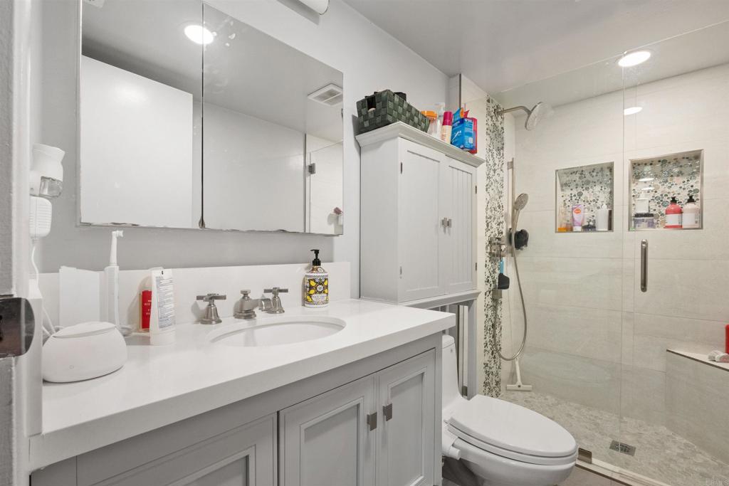 14102 Tobiasson Road Poway, CA 92064 - Photo 15 of 23 a bathroom with a sink a toilet and shower