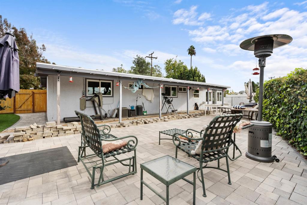 14102 Tobiasson Road Poway, CA 92064 - Photo 18 of 23 a view of a dinning table and chairs in patio