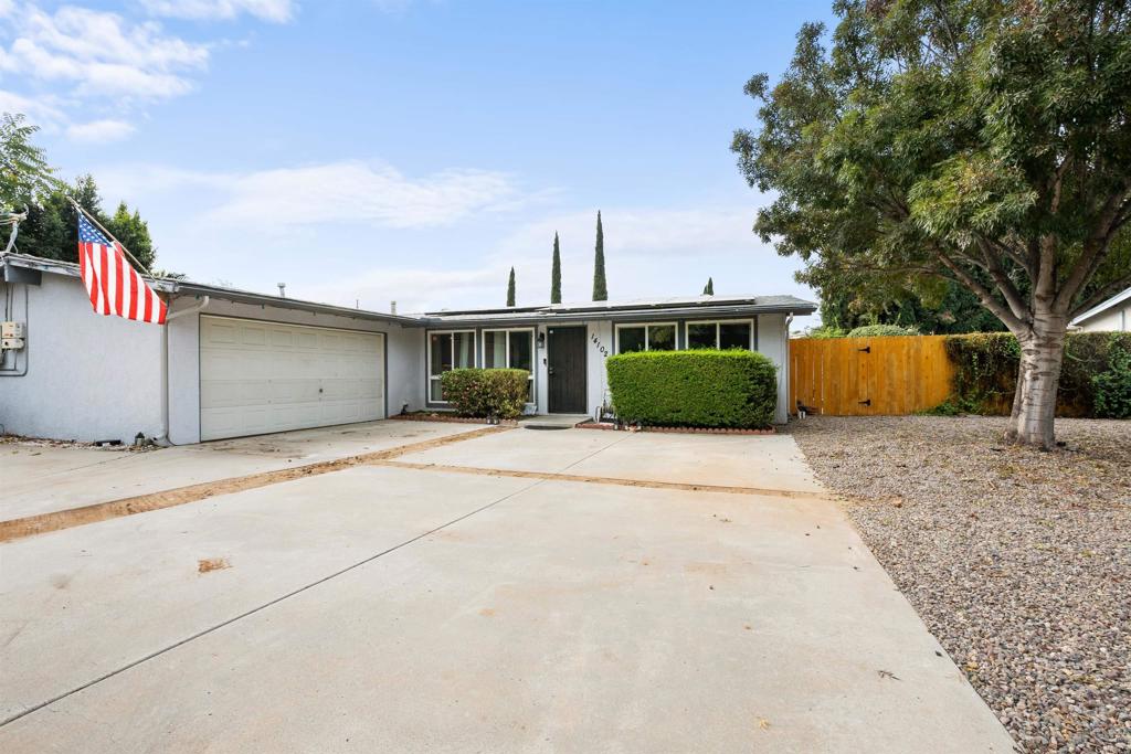 14102 Tobiasson Road Poway, CA 92064 - Photo 20 of 23 a front view of a house with a yard and garage