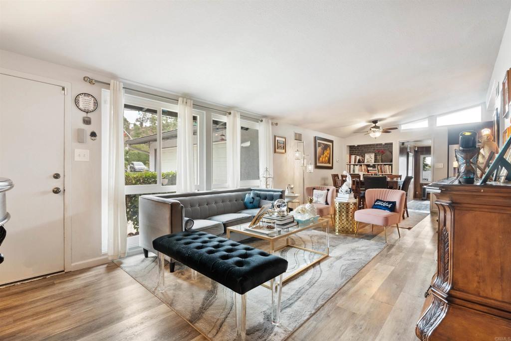 14102 Tobiasson Road Poway, CA 92064 - Photo 4 of 23 a living room with furniture and wooden floor