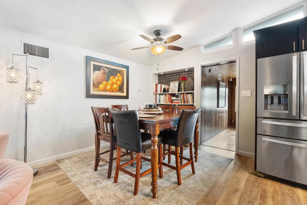 14102 Tobiasson Road Poway, CA 92064 - Photo 6 of 23 a view of a dining room with furniture and wooden floor