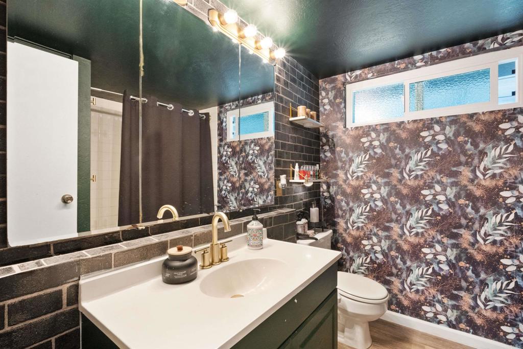 14102 Tobiasson Road Poway, CA 92064 - Photo 9 of 23 a bathroom with a sink toilet and shower