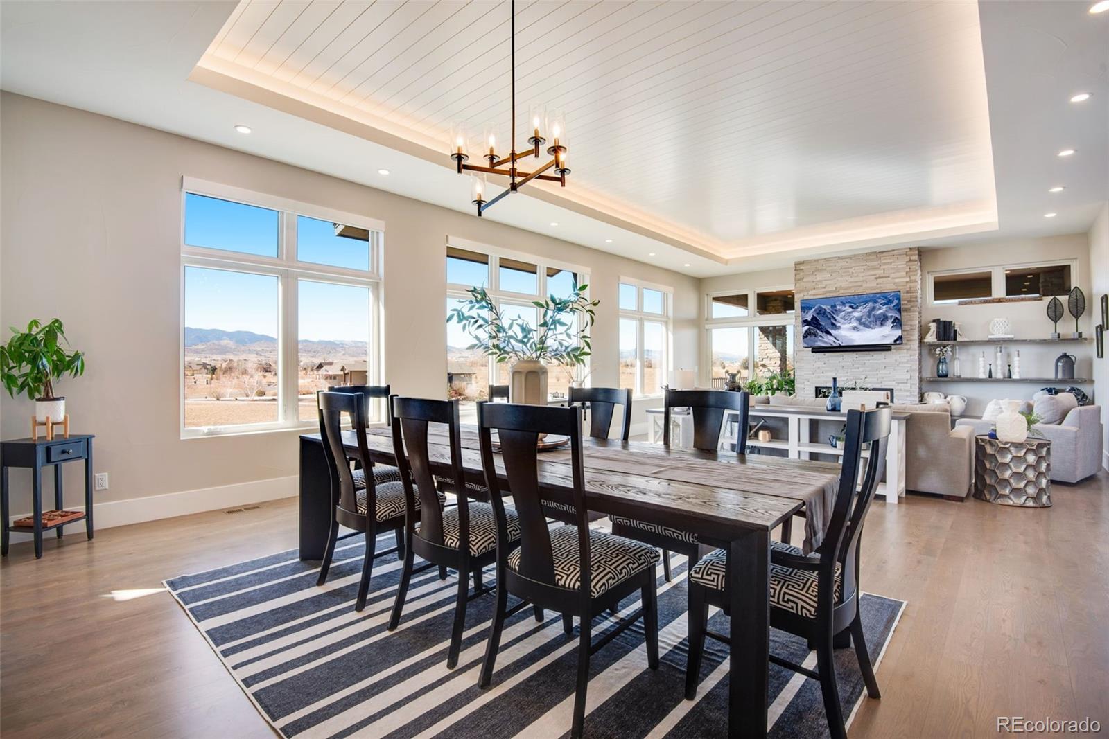 3210 Mallard Creek Road Berthoud, CO 80513 - Photo 22 of 40 a view of a dining room with furniture window and wooden floor