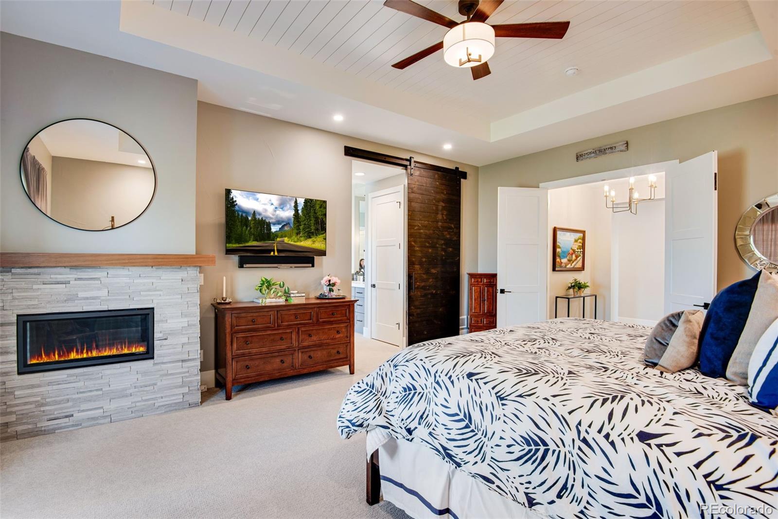 3210 Mallard Creek Road Berthoud, CO 80513 - Photo 26 of 40 a bed room with furniture and a fireplace