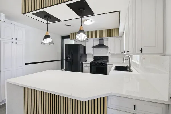 a kitchen with a refrigerator a sink and dishwasher