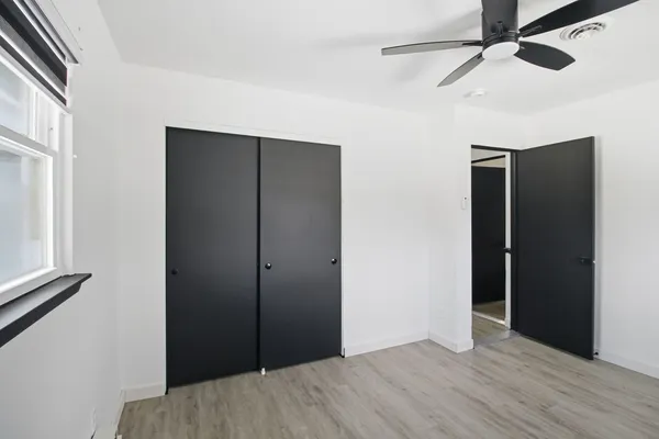 a view of hallway with wooden floor