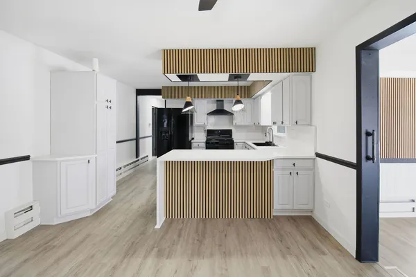 a view of a kitchen from the hallway