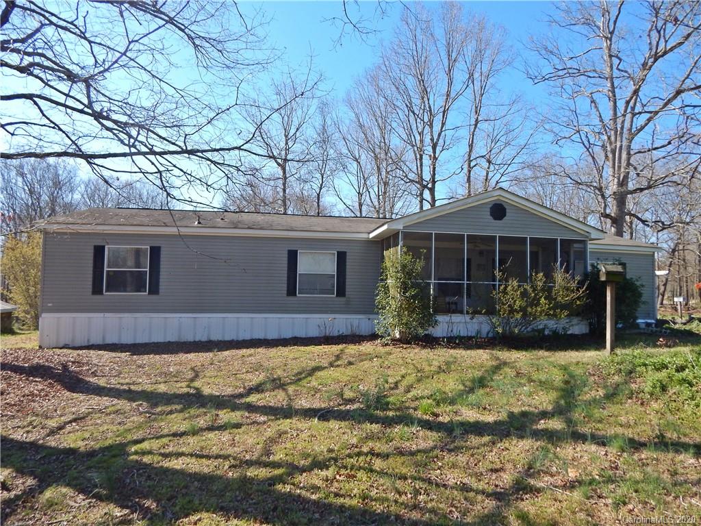 2193 State Rd S-13-106 Pageland, SC 29728 - Photo 1 of 19 a front view of a house with a yard