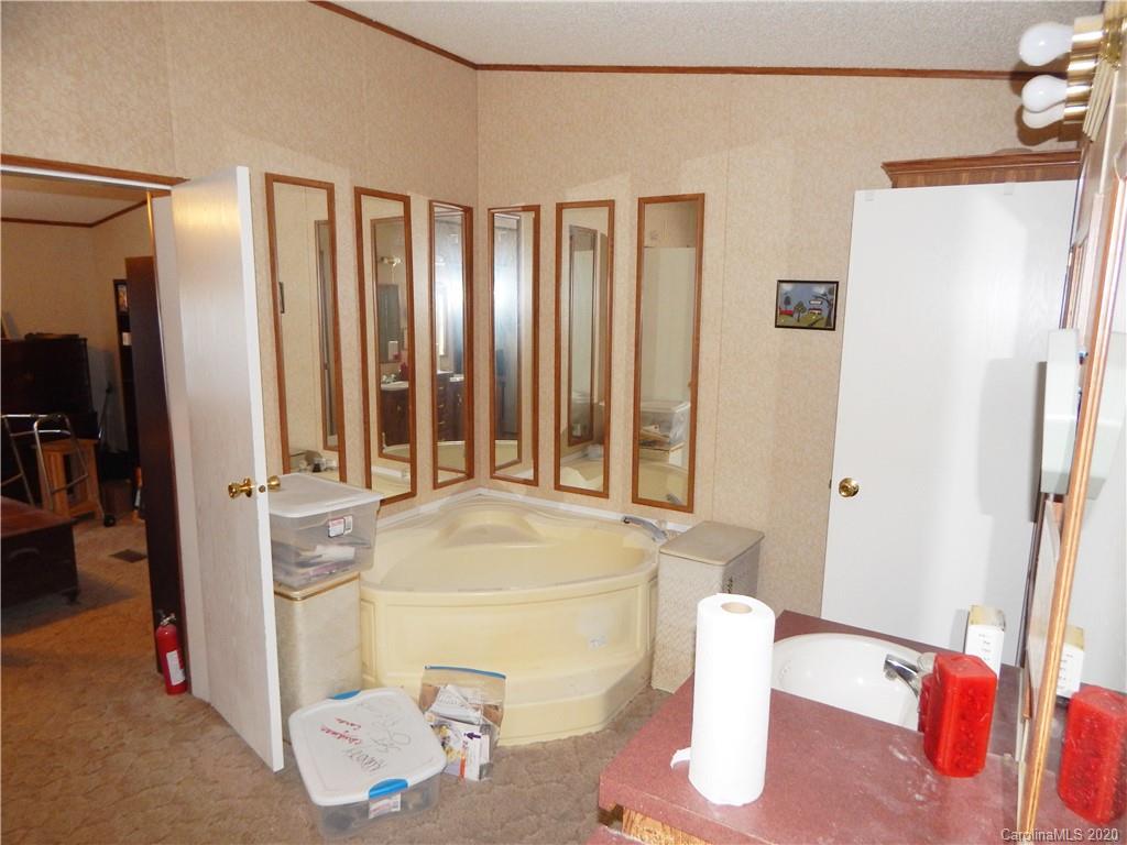2193 State Rd S-13-106 Pageland, SC 29728 - Photo 11 of 19 a spacious bathroom with a tub and shower