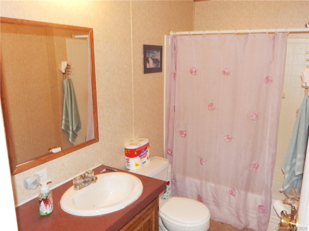 2193 State Rd S-13-106 Pageland, SC 29728 - Photo 14 of 19 a bathroom with a sink toilet and shower