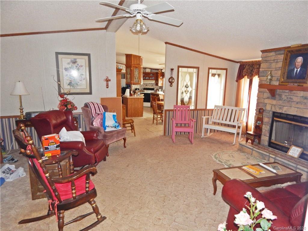 2193 State Rd S-13-106 Pageland, SC 29728 - Photo 3 of 19 a living room with furniture and a fireplace