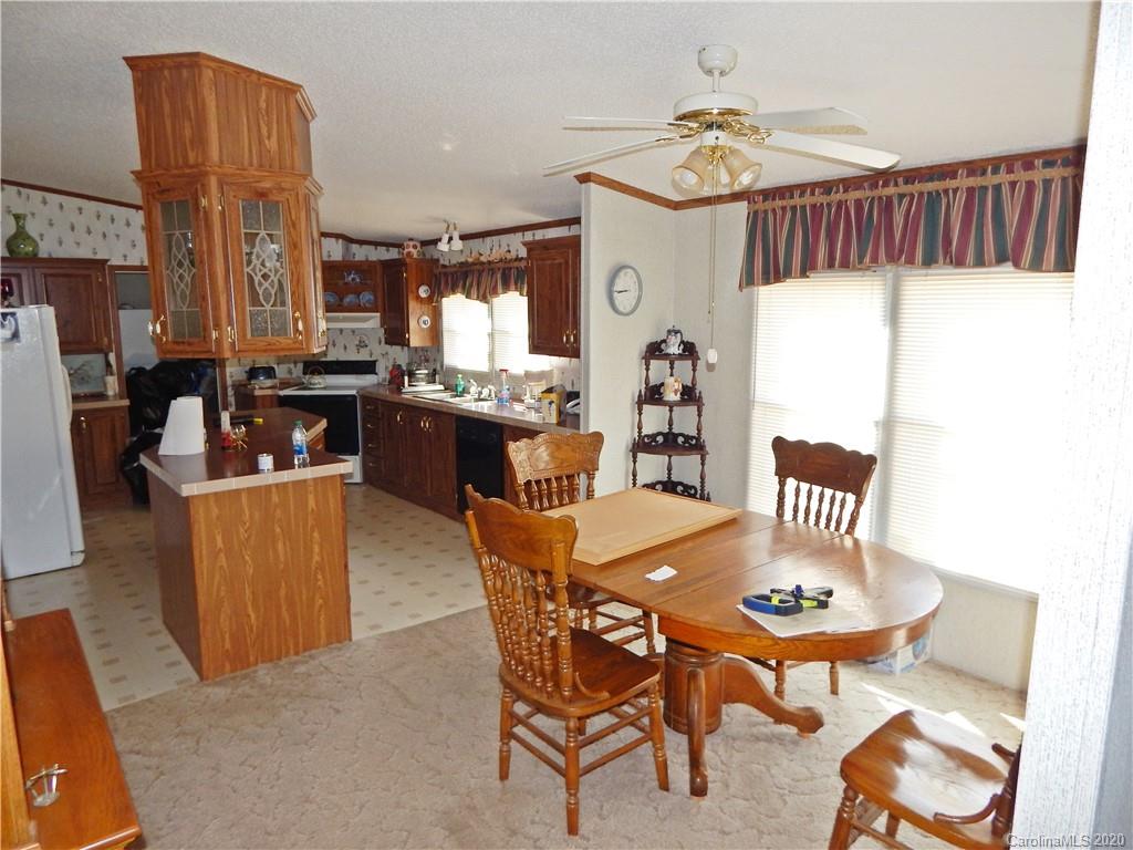 2193 State Rd S-13-106 Pageland, SC 29728 - Photo 5 of 19 a dining room with furniture and window