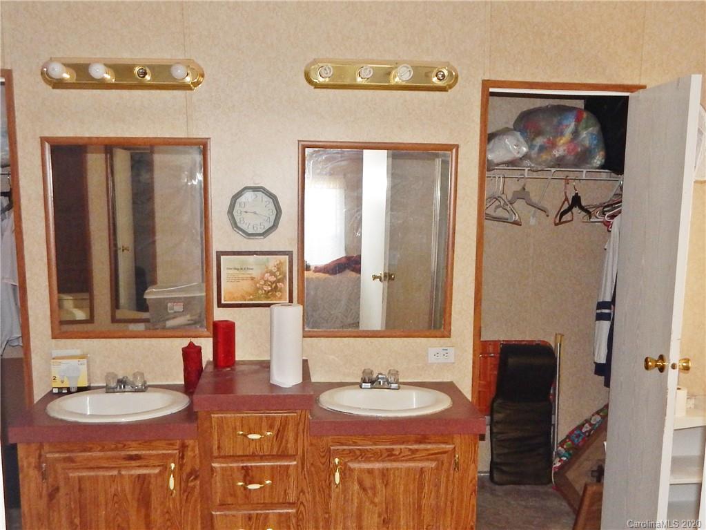 2193 State Rd S-13-106 Pageland, SC 29728 - Photo 10 of 19 a bathroom with 2 sink and a mirror