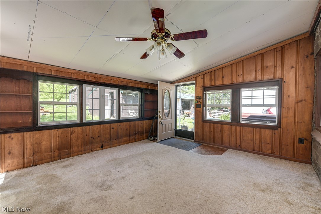343 Bellus Road Hinckley, OH 44233 - Photo 11 of 49 Family room with a healthy amount of sunlight, lofted ceiling, carpet floors, and ceiling fan