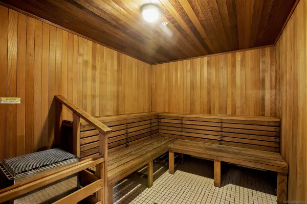 a view of a balcony with chairs and stairs