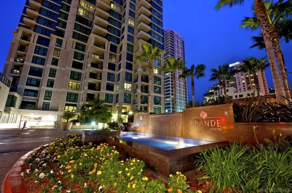 a view of a swimming pool with an outdoor seating and a potted plant