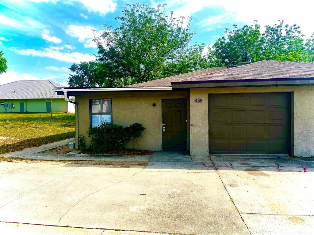 a view of outdoor space parking and yard