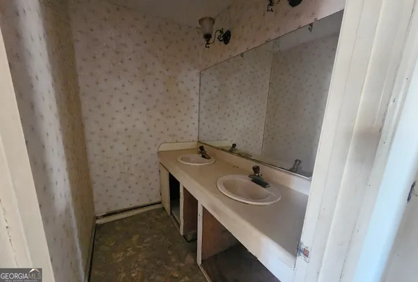 a bathroom with a sink and a mirror