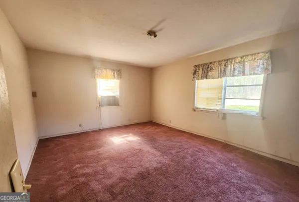 an empty room with windows