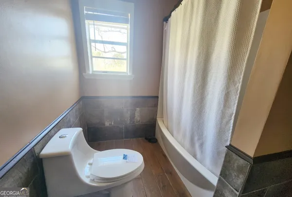 a bathroom with a toilet and a sink