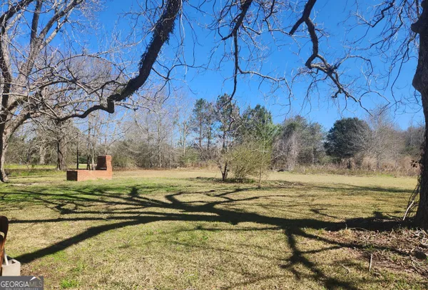 a view of a backyard of the house