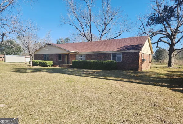 a house with yard in front of it