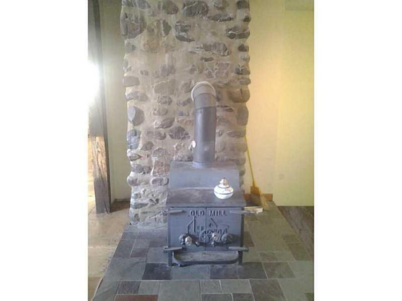 407 East Ridge Road Skowhegan, ME 04976 - Photo 19 of 35 Kitchen. Field Stone Fireplace and...